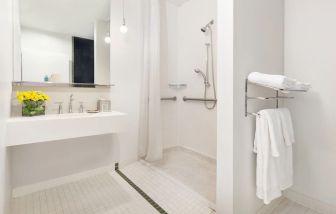 Guest bathroom with shower at Nu Hotel - Brooklyn.