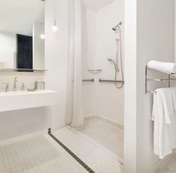 Guest bathroom with shower at Nu Hotel - Brooklyn.