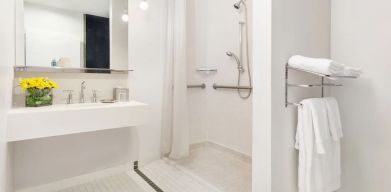 Guest bathroom with shower at Nu Hotel - Brooklyn.