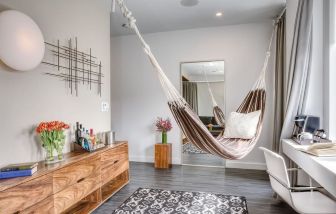 Relaxing day room with hammock and chilled-out workspace at Nu Hotel - Brooklyn.