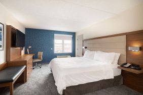 Delux king room with desk and TV at Holiday Inn Express & Suites Boston-Cambridge.