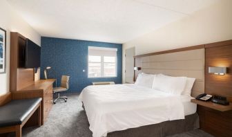 Delux king room with desk and TV at Holiday Inn Express & Suites Boston-Cambridge.