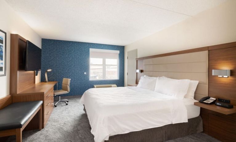 Delux king room with desk and TV at Holiday Inn Express & Suites Boston-Cambridge.