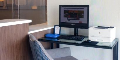 Dedicated business center with PC, internet, and printer at Holiday Inn Express & Suites Boston-Cambridge.