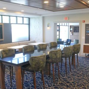 Dining and coworking space at Holiday Inn Express & Suites Boston-Cambridge.