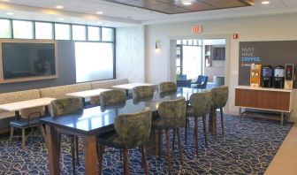 Dining and coworking space at Holiday Inn Express & Suites Boston-Cambridge.