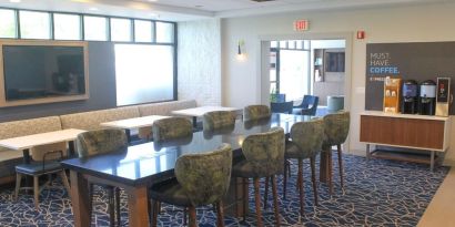 Dining and coworking space at Holiday Inn Express & Suites Boston-Cambridge.