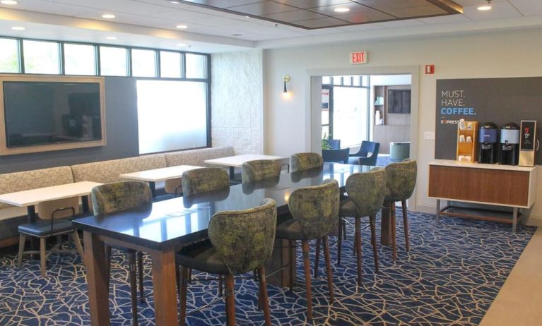 Dining and coworking space at Holiday Inn Express & Suites Boston-Cambridge.