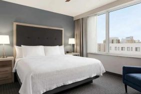 spacious king suite with work area and TV at Homewood Suites by Hilton University City.