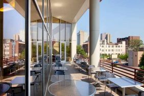 pretty outdoor terrace ideal as a coworking space at Homewood Suites by Hilton University City.