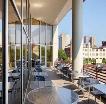 pretty outdoor terrace ideal as a coworking space at Homewood Suites by Hilton University City.