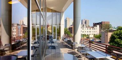 pretty outdoor terrace ideal as a coworking space at Homewood Suites by Hilton University City.