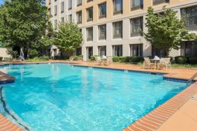 Stunning outdoor pool with seating area at DoubleTree Atlanta Airport.