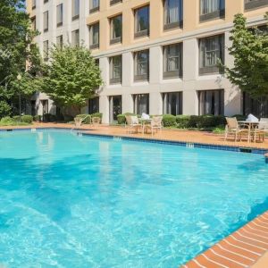 Stunning outdoor pool with seating area at DoubleTree Atlanta Airport.