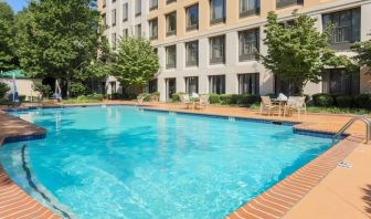 Stunning outdoor pool with seating area at DoubleTree Atlanta Airport.