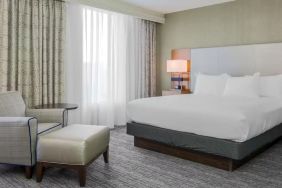 King bed with natural light at DoubleTree Atlanta Airport.