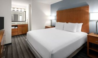 King bedroom with TV at Hyatt House Scottsdale.