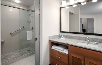 Private guest bathroom with shower at Hyatt House Scottsdale.