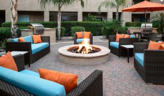 Outdoor lounge and coworking space with fire pit at Hyatt House Scottsdale.