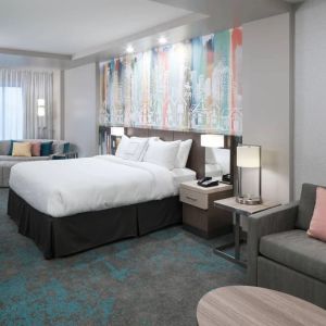 Delux king room with work space and lounge area at Courtyard By Marriott Houston Heights/I-10.