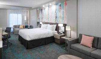 Delux king room with work space and lounge area at Courtyard By Marriott Houston Heights/I-10.