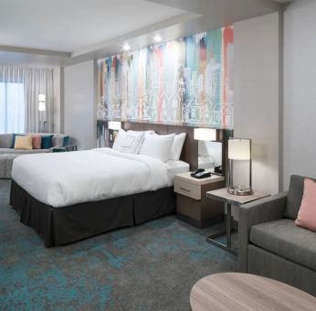 Delux king room with work space and lounge area at Courtyard By Marriott Houston Heights/I-10.