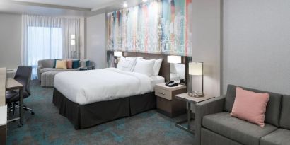 Delux king room with work space and lounge area at Courtyard By Marriott Houston Heights/I-10.