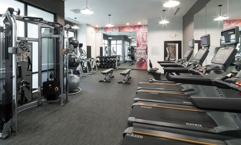 Well equipped fitness center at Courtyard By Marriott Houston Heights/I-10.