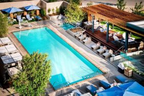 Lovely outdoor pool with pool chairs at Hotel Nia, Autograph Collection.