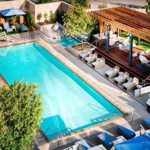 Lovely outdoor pool with pool chairs at Hotel Nia, Autograph Collection.