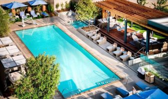 Lovely outdoor pool with pool chairs at Hotel Nia, Autograph Collection.