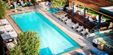 Lovely outdoor pool with pool chairs at Hotel Nia, Autograph Collection.