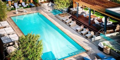 Lovely outdoor pool with pool chairs at Hotel Nia, Autograph Collection.