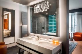 Private guest bathroom with shower at Hotel Nia, Autograph Collection.