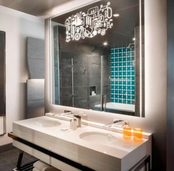 Private guest bathroom with shower at Hotel Nia, Autograph Collection.