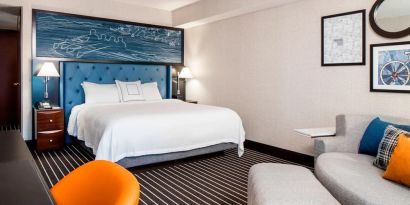 King bedroom with business desk at Courtyard By Marriott Boston Brookline.