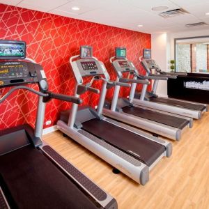 Well equipped fitness center at Courtyard By Marriott Boston Brookline.