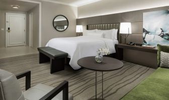 Comfortable king bedroom with lounge area at The Westin New Orleans.