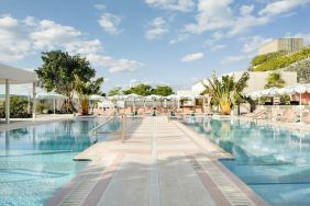 Stunning outdoor pool with pool seating area at The Goodtime Hotel.