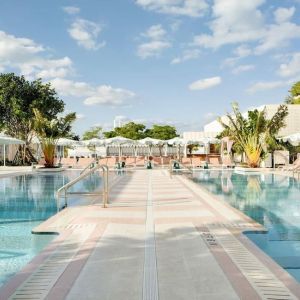 Stunning outdoor pool with pool seating area at The Goodtime Hotel.