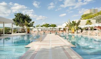 Stunning outdoor pool with pool seating area at The Goodtime Hotel.