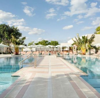 Stunning outdoor pool with pool seating area at The Goodtime Hotel.