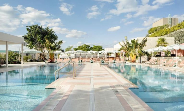 Stunning outdoor pool with pool seating area at The Goodtime Hotel.