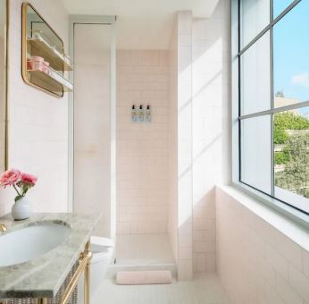 Guest bathroom with shower at The Goodtime Hotel.