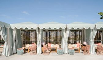 Shaded seating area outside ideal for coworking at The Goodtime Hotel.