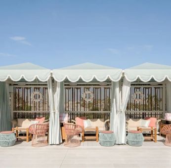 Shaded seating area outside ideal for coworking at The Goodtime Hotel.