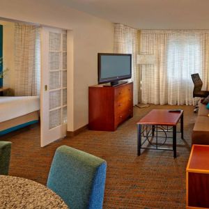 Day use room with TV and lounge area at Residence Inn Boston Tewksbury.
