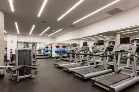 Equipped fitness center at Courtyard By Marriott Long Island City/New York Manhattan View.