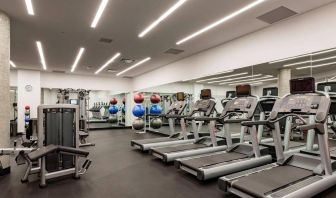 Equipped fitness center at Courtyard By Marriott Long Island City/New York Manhattan View.