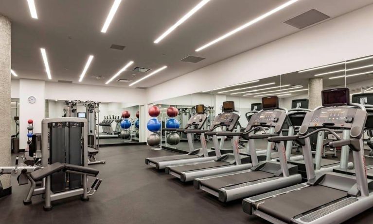 Equipped fitness center at Courtyard By Marriott Long Island City/New York Manhattan View.